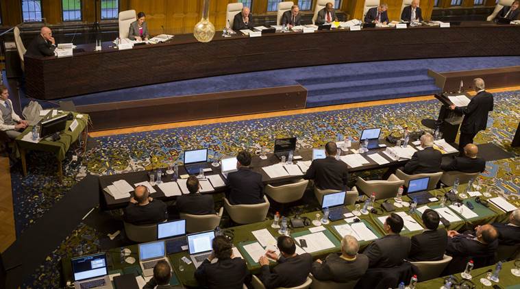 In this Nov. 24, 2015, image provided by the Permanent Court of Arbitration, a tribunal of five arbitrators, seated top right, hears the case regarding the Philippines and China on the South China Sea at the Permanent Court of Arbitration (PCA) at The Hague, the Netherlands. A landmark ruling on an arbitration case filed by the Philippines that seeks to strike down China's expansive territorial claims in the South China Sea will be a test for international law and world powers. China, which demands one-on-one talks to resolve the disputes, has boycotted the case and vowed to ignore the verdict, which will be handed down Tuesday, July 12, 2016, by the U.N. tribunal in The Hague.(Permanent Court of Arbitration via AP)