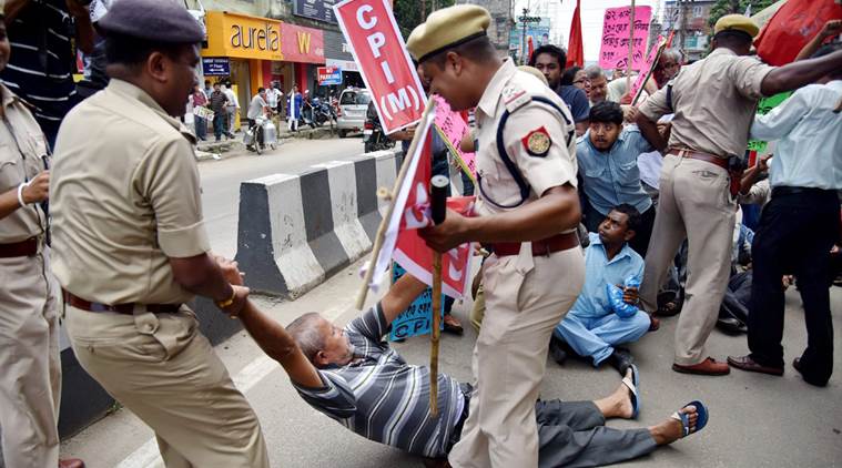 Guwahati : Left parties activists being detained by the police personnel during a protest against the government's move to privatize 12 Oil fields of Assam, in Guwahati on Friday. PTI Photo (PTI7_15_2016_000318A)