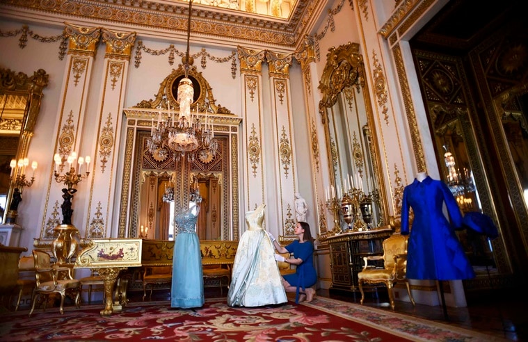 REFILE - CORRECTING SPELLING OF SURNAME - Exhibition curator Caroline de Guitaut poses for photographers as she shows off a preview of an exhibition entitled 'Fashioning a Reign: 90 Years of Style from The Queen's Wardrobe,' charting the reign of Britain's Queen Elizabeth through a display of her formal and informal outfits, at Buckingham Palace, in central London, Britain July 4, 2016.    REUTERS/Dylan Martinez