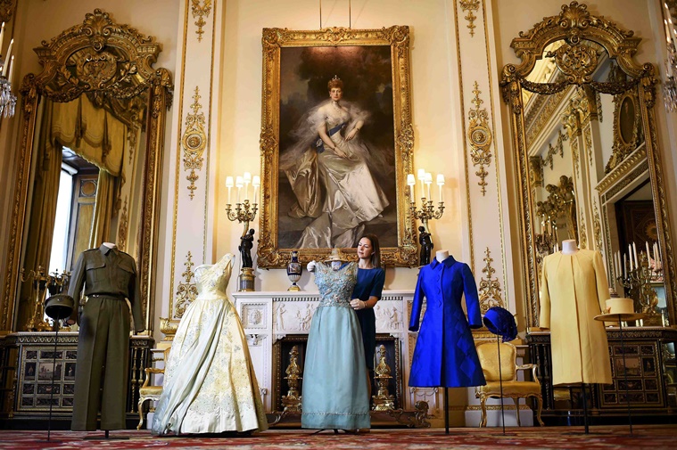REFILE - CORRECTING SPELLING OF SURNAME - Exhibition curator Caroline de Guitaut poses for photographers as she shows off a preview of an exhibition entitled 'Fashioning a Reign: 90 Years of Style from The Queen's Wardrobe,' charting the reign of Britain's Queen Elizabeth through a display of her formal and informal outfits, at Buckingham Palace, in central London, Britain July 4, 2016.    REUTERS/Dylan Martinez
