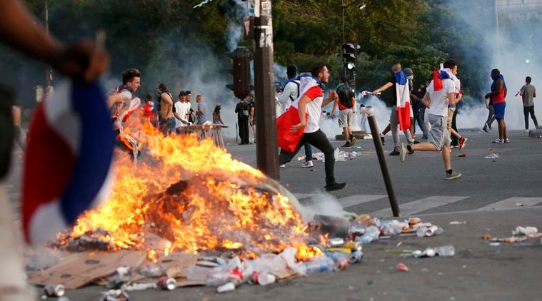 French police fired tear gas to disperse dozens of people trying to enter the "fan zone" at the foot of the Eiffel Tower to watch the final of the Euro 2016 to prevent overcrowding. (Source: REUTERS)