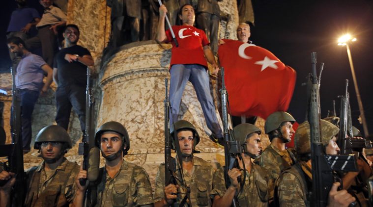 Turkish soldiers secure the area as supporters of Turkey's President Recep Tayyip Erdogan protest in Istanbul's Taksim square, early Saturday, July 16, 2016. Turkey's prime minister says a group within Turkey's military has engaged in what appeared to be an attempted coup. Binali Yildirim told NTV television: "it is correct that there was an attempt." (AP Photo/Emrah Gurel)