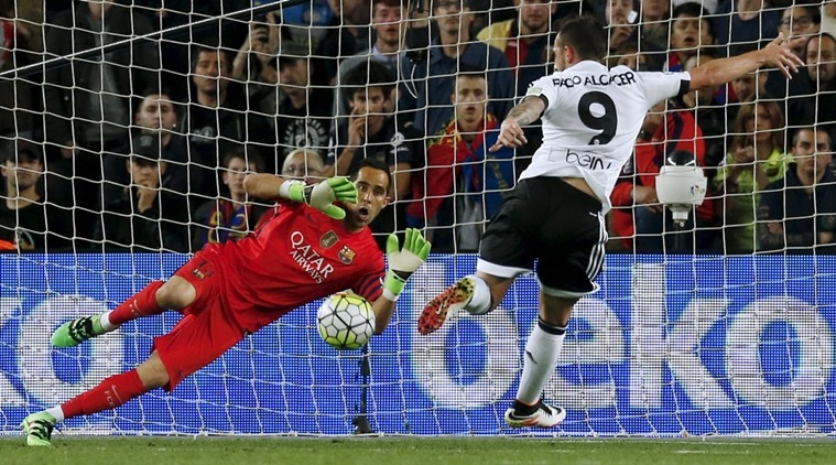Football Soccer - Barcelona v Valencia - Spanish Liga BBVA - Camp Nou stadium, Barcelona - 17/4/16Barcelona's goalkeeper Claudio Bravo blocks a ball against Valencia's Paco Alcacer. REUTERS/Albert Gea