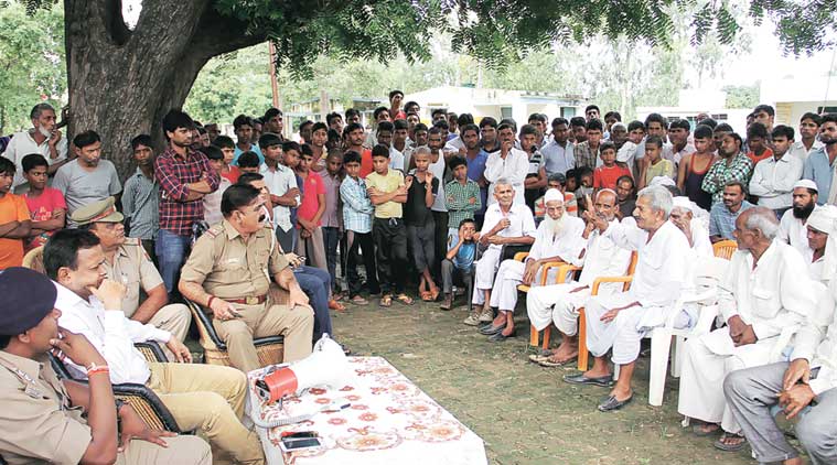 Village pradhan, circle officer and subdivisional magistrate address a peace meeting at Kadali village, in Muzaffarnagar on Monday. (Source: Express photo by Gajendra Yadav)