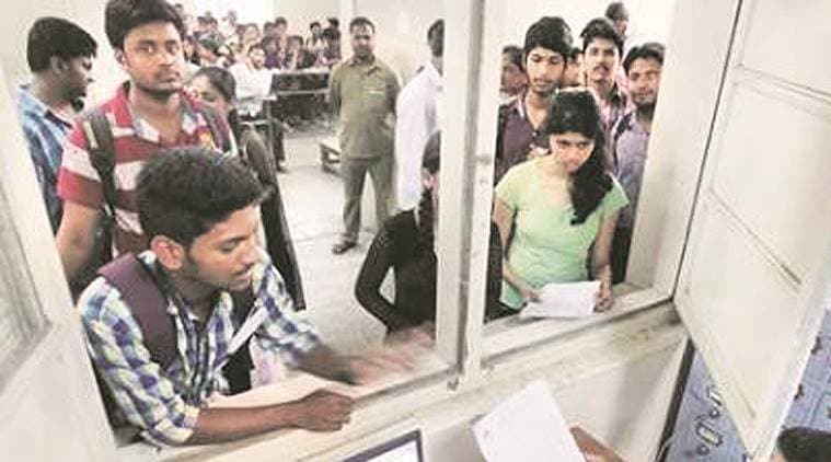 Students submitting forms for FYJC admissions at Garware College on Tuesday.Express Photo By Sandeep Daundkar, Pune, 09.06.2015