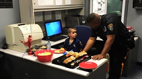 boy feeds cops in new jersey, new jersey boy's good deed, winslow cops fed by boy, boy uses pocket money to feed police
