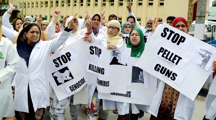 Srinagar: Nurses and paramedics hold placards and shout slogans during a protest rally against the killing of 55 civilians and use of pellet guns by forces, outside SMHS Hospital in Srinagar on Monday. PTI Photo (PTI8_8_2016_000199A)