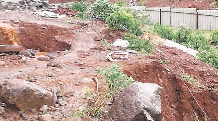 Landslide in Lavasa near Ekaant resort on Wednesday. The work to clea the debris was on till Thursday evening.Express Photo,04.08.16,Pune