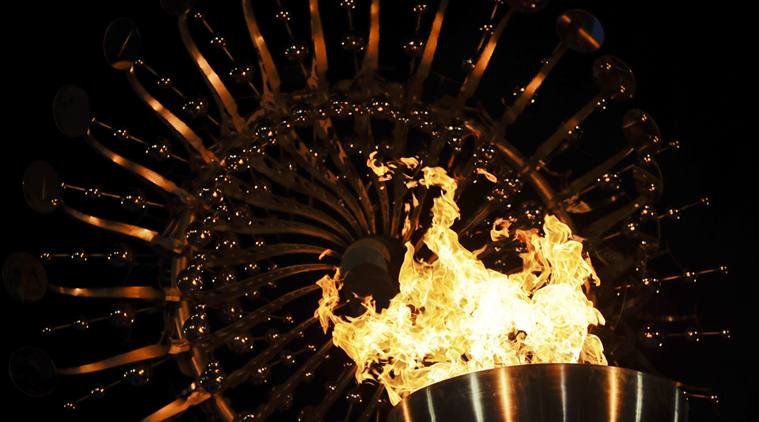 FILE - In this Saturday, Aug. 6, 2016, file photo, flames burn in the Olympic cauldron after being lit during the opening ceremony of the 2016 Summer Olympics in Rio de Janeiro, Brazil. The Rio Games officially end with a closing ceremony Sunday, Aug. 21. (AP Photo/Gregory Bull, File)