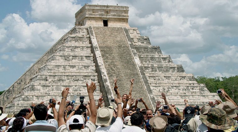Villagers and tourists celebrate next to the Kukulkan pyramid at the Mayan ruins of Chichen Itza in Mexico's Yucatan peninsula (Source: Victor Ruiz/Reuters)