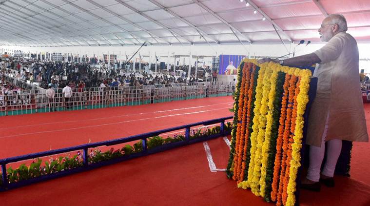Prime Minister Narendra Modi addresses at the inauguration of the first phase of Saurashtra Narmada Avataran for Irrigation (SAUNI) project in Rajkot on Tuesday. PTI Photo