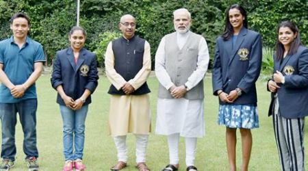 New Delhi : Prime Minister Narendra Modi and sports Minister Vijay Goel pose with Olympic Medal Winners, Khel Ratna Awardees in New Delhi on Sunday. The players are silver medallist shuttler P V Sindhu (2R) bronze medal winning wrestler Sakshi Malik (R), gymnast Dipa Karmakar (2L) and ace shooter Jitu Rai (L). PTI Photo (PTI8_28_2016_000162B)