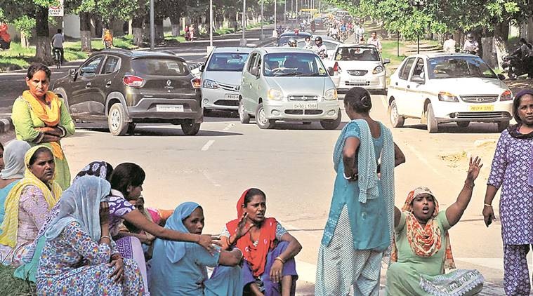 Residents of sector 25 Colony blocked the rod during their protest after a boy was murdered in Chandigarh on Thursday, August 04 2016. Express Photo by Sahil Walia