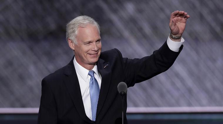 FILE - In this July 19, 2016 file photo, Sen. Ron Johnson, R-Wis., who is running against Democratic Senate candidate Russ Feingold in the November election, waves to the delegates during the Republican National Convention in Cleveland. Feingold had harsh words for Republican presidential nominee Donald Trump on Wednesday, July 27, 2016, calling him unfit to be president and questioning how much longer his Republican opponent, Johnson, could support Trump. Johnson, who has said he supports but does not endorse Trump, said through a spokesman that Russia should "stay out of our elections." (AP Photo/J. Scott Applewhite, File)
