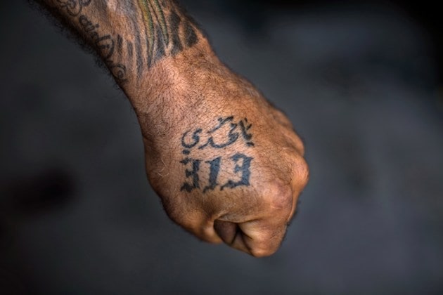 Photo essay: Shiite Muslims tattoo themselves as a show of pride amid