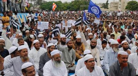 Muslims and hundreds of members of India’s low-caste Dalit community gather for a rally in Una, Gujarat state, India, Monday, Aug. 15, 2016. The Dalits have been protesting since four men belonging to their community were beaten while trying to skin a dead cow in July near this western Indian town. Videos of the four being stripped and beaten with sticks by men claiming to be cow protectors in Gujarat state had gone viral and sparked protests by Dalit groups across India. The Dalits, belong to the lowest rung of Hinduism's caste hierarchy. (AP Photo/Ajit Solanki)