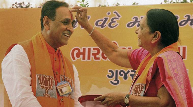Gandhinagar : File photo of Vijay Rupani with the then Chief Minister Anandiben Patel in Gandhinagar in Feb 2016. Rupani was on Friday chosen by the Gujarat BJP as the States next Chief Minister. PTI Photo (PTI8_5_2016_000303B)
