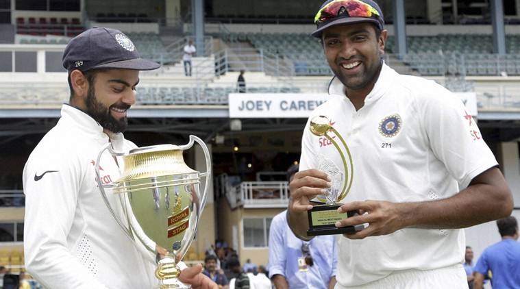 Viral Kohli with Indian Trophy and Ashwin with his Trophy (indianexpress.com) 