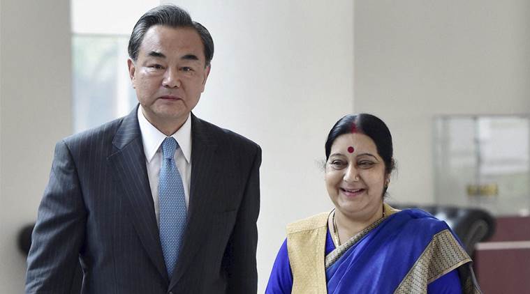 Visiting Chinese Foreign Minister Wang Yi, left and India's External Affairs Minister Sushma Swaraj arrive for a meeting in New Delhi, India, Saturday, Aug.13, 2016. (Kamal Kishore/Press Trust of India via AP)