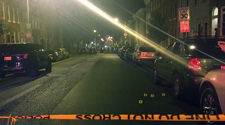 Police investigate the scene of a multiple shooting in Baltimore on Saturday, Sept. 24, 2016. A police spokesperson said none of the injuries are life threatening. (AP Photo/Juliet Linderman)