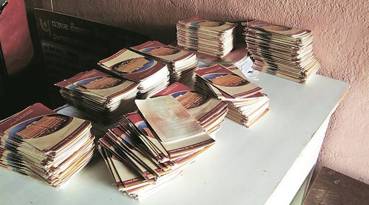 Passbooks with deposits of `1 at the office of a bank agent in Barh, Bihar. Source: Shyamlal Yadav