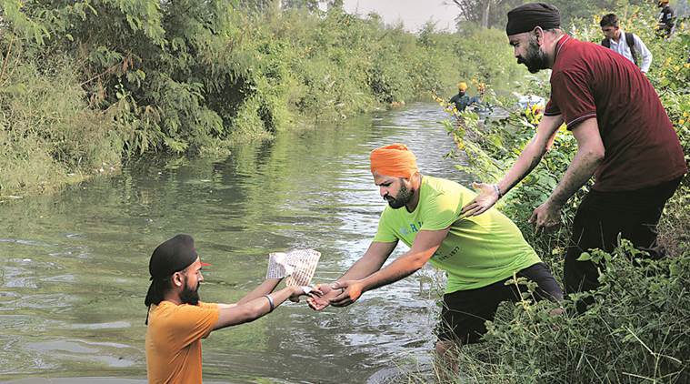 Guru Granth Sahib, Guru Granth Sahib torn, Jalandhar,Jalandhar protests, Gita, Gita torn, Bhagwad Gita torn, Jalandhar news, India news