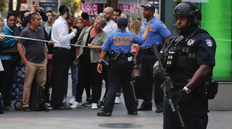 Man attacks police officer with meat cleaver in New York, gets shot ...