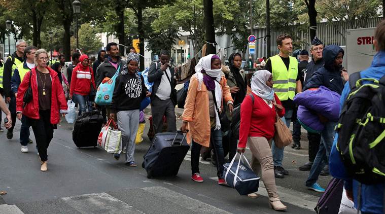 Paris police dismantle camp housing 2,100 migrants | World News - The ...