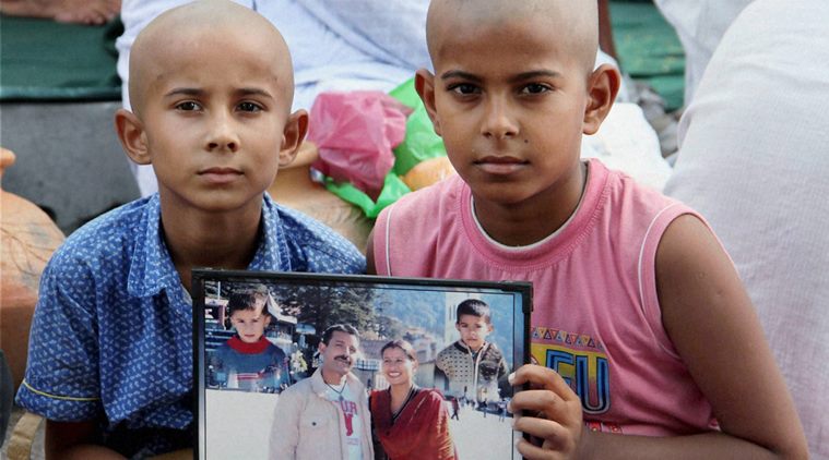 Samba : Sons of Havildar Ravi Paul who was martyred in Sunday's terrorist attack at Uri Army camp, at their native village, Sarwa in Samba on Monday. PTI Photo (PTI9_19_2016_000125B)
