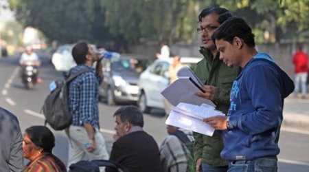Candidates outside main gate before entering one of the PGIMER Examination Centrers in Chandigarh on Sunday, December 01 2013. Express photo by Jasbir Malhi