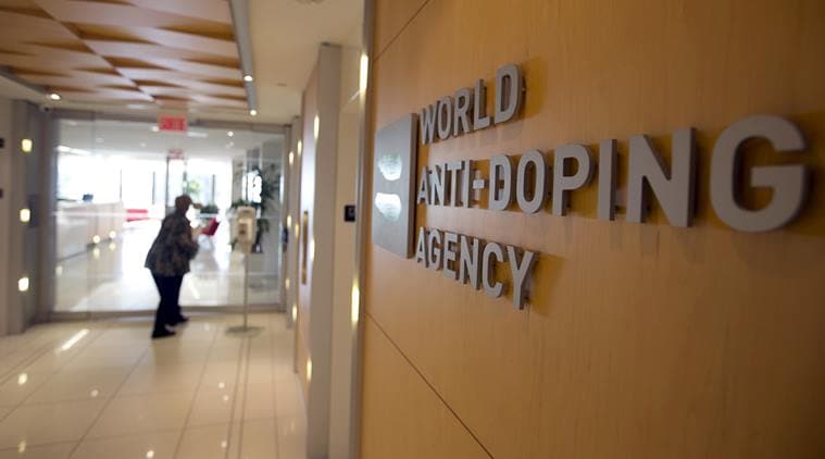 A woman walks into the head offices of WADA in Montreal