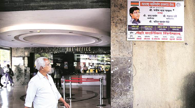 MNS workers replaced a poster of Ae Dil Hai Mushkil with their party union hoarding, at Metro Cinema Hall in South Mumbai on Thursday. Source: Nirmal Harindran