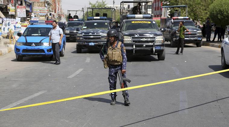 Iraqi security forces close the scene of a suicide bomb attack at a gathering of construction workers in the eastern New Baghdad neighborhood, Iraq, Tuesday, Sept. 27, 2016. Separate suicide bombings ripped through busy commercial areas in Shiite-dominated neighborhoods of the Iraqi capital on Tuesday, killing and wounding civilians, officials said. (AP Photo/Karim Kadim)