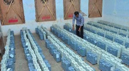 Kasaragod: A polling officer arranges EVMs at a distribution centre on the eve of assembly elections in Kasaragod on Sunday. PTI Photo  (PTI5_15_2016_000147B)