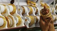 A customer tries gold bangles inside a jewellery showroom at Noida delhi wedding robbery, jewelry robbery, wedding jewelry robbery, delhi news, india news, latest news, indian express
