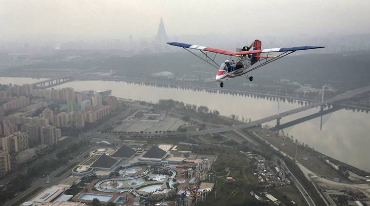 An ultralight aircraft flies over the city of Pyongyang on Sunday, Oct. 16, 2016, in North Korea. Until a few months ago, if you wanted a bird's eye view of North Korea's capital there was basically only one option: a 150-meter tall tower across the river from Kim Il Sung Square. Now, if you have the cash, you can climb into the backseat of an ultralight aircraft. With the support of North Korean leader Kim Jong Un, who has vowed to give North Koreans more modern and "cultured" ways to spend their leisure time, a Pyongyang flying club has started offering short flights over some of the capital's major sights. (AP Photo/Wong Maye-E)