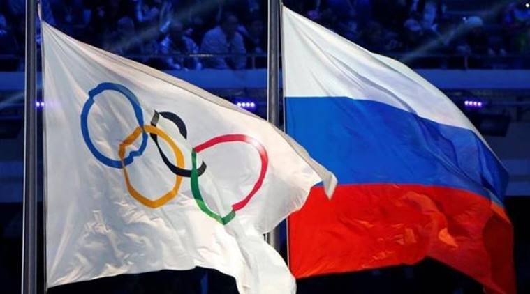 Russian national flag and Olympic flag are seen during closing ceremony for 2014 Sochi Winter Olympics