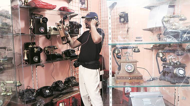 Sunny Shyam owns a shop that sells antique telephones. (Express Photo by Ganesh Shirsekar)