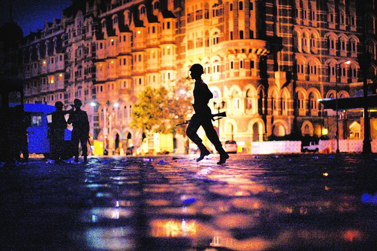 The Intelligence failure in the run-up to the November 26 attacks and the crossed wires during the 60-hour siege *** Local Caption *** "FOR USE AS DESIRED WITH YEAR END--FILE **In this Nov. 29, 2008 file photo, an Indian soldier runs to take cover in front of the Taj Mahal hotel as Indian troops and militants battle in Mumbai, India. (AP Photo/David Guttenfelder/FILE)"