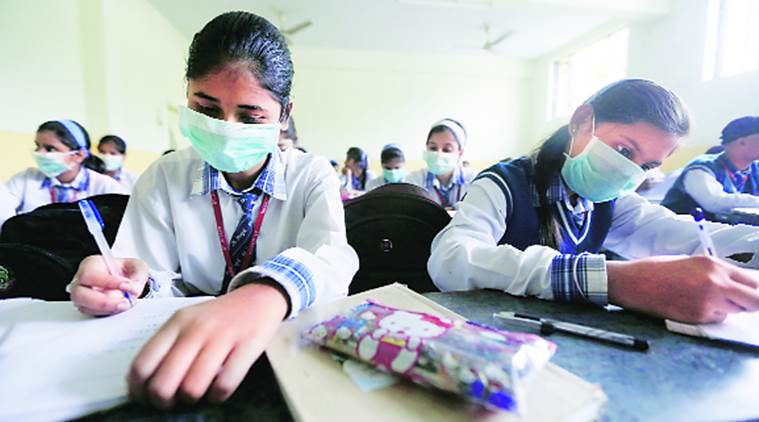 A sign of times to come: Students attend classes wearing medicated masks at a school in Lucknow on Tuesday. (express phoyo by Vishal Srivastav)