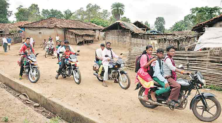 Padaboria village residents riding on their newly-bought bikes. (Express Photo: Deepak Daware)
