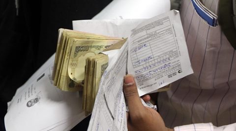 The woman, Nirmala Devi, was standing towards the tail end of the queue when a man snatched the cloth bag she was carrying and fled, said police.