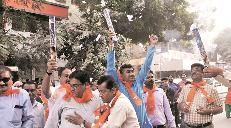 Deputy CM Nitin Patel and other party leaders in Gandhinagar; celebrations in Ahmedabad , on Tuesday. PTI