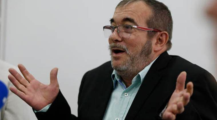 Rodrigo Londono, top leader of the Revolutionary Armed Forces of Colombia, FARC, speaks during a roundtable with foreign journalists in Bogota, Colombia, Friday, Nov. 25, 2016, a day after he signed a second, modified peace accord with Colombia's President Juan Manuel Santos to end the country's half-century conflict. (AP Photo/Fernando Vergara)