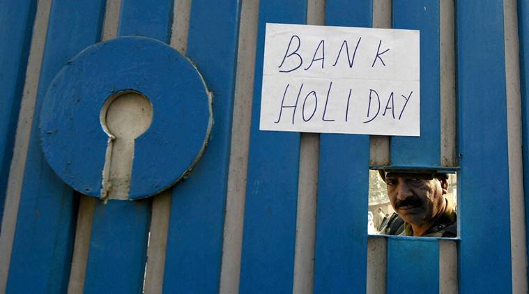 Srinagar: A notice is pasted on the main gate of State Bank of India after Central goverment order of demonetisation of 500 and 1,000 rupee Indian currency in Srinagar on Wednesday. PTI Photo by S Irfan(PTI11_9_2016_000300a)