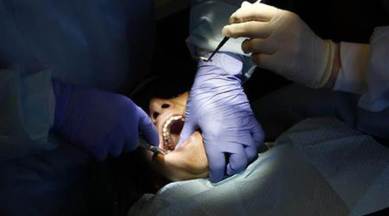 dentist drops pin, woman chokes on pin, woman pin accident, dentist leaves pin, dentist leaves pin in patients mouth, world news