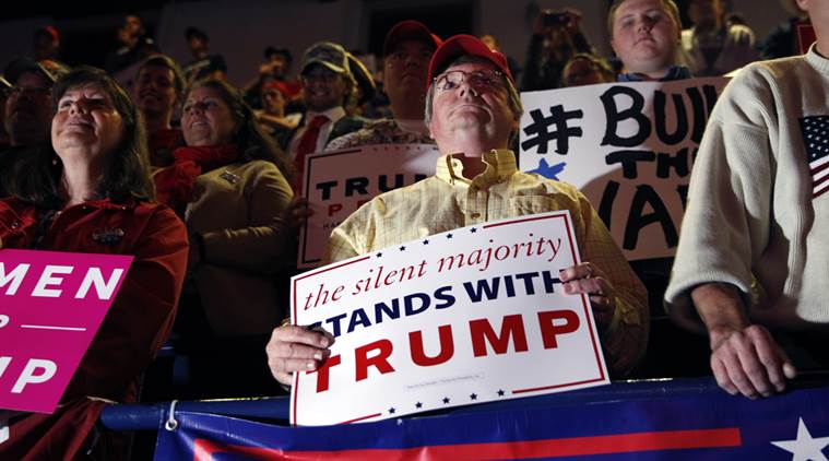 Supporter of Trump holding a banner