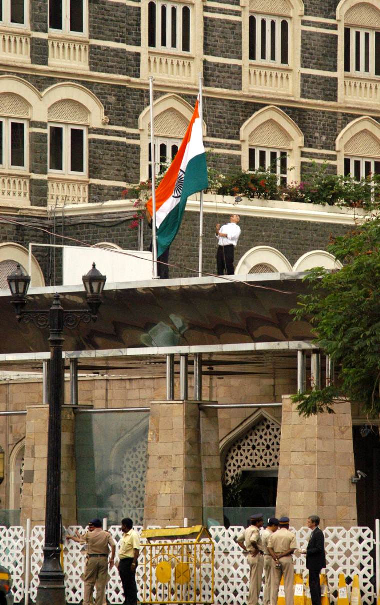 For the first time Taj Mahal Hotel hoist the tricolour Indain flag post militant attack on Sunday. Express Photo by Ganesh Shirsekar, Mumbai, 30/11/2008