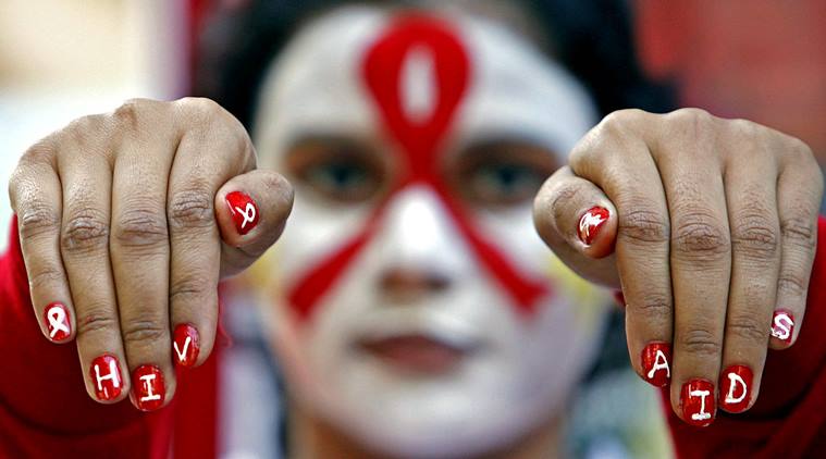 Students of Social Work Department painted their faces to spread awareness about HIV/AIDS during a campaign to mark World AIDS Day, at Panjab University in Chandigarh on Friday, November 29 2013. Express photo by Sumit Malhotra