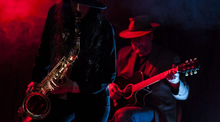 Lady saxophonist and a guitarist (Source: Thinkstock images)